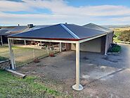 Modern carport with a sleek gable roof design built by Aldinga Home Improvements, providing durable and stylish prote...