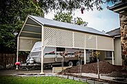 Spacious outdoor pergola with a flat roof design by Aldinga Home Improvements, offering a stylish and shaded area for...