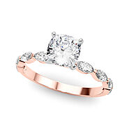 Rose gold Cushion Solitaire with Side Stones on a Pavé Band and Four-Prong Setting