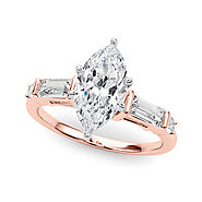Rose gold Marquise Cut Diamond Ring with Baguette Side Stones, Channel Set Band, and Four-Prong Setting
