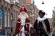 Sinterklaas and his helper Zwarte Piet Hand Out Candy and Gifts On Dec 5th In The Netherlands
