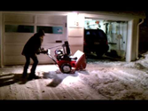 Angela learning how to use the snowblower.