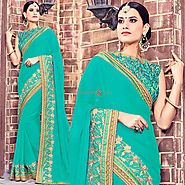 Latest Sea Green Party Wear Sari With Transparent Back Sleeveless Blouse