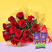 Buy/Send Red Blooms With Chocolaty Treats Online - YuvaFlowers.com