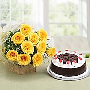 12 Yellow Roses in a cellophane packing with yellow ribbon and 500 grams Blackforest Cake - OyeGifts.com