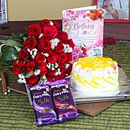 Buy/Send Roses with Pineapple Cake and Cadbury Silk for Birthday - YuvaFlowers