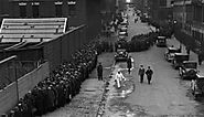 winding-breadline-in-manhattan-on-christmas - Soup Kitchens and Breadlines Pictures - Great Depression - HISTORY.com