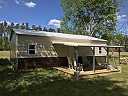 Get Metal Hunting Cabin with Lean-to Porch from Metal Carports Direct