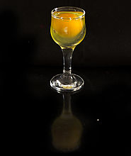 Photo of an egg in a glass on black background