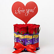 Buy or Order Red Roses And Dairy Milk Arrangement - Midnight Gifts Delivery Online : OyeGifts