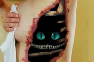 Take a look at some of the FREAKIEST new 3D tattoos: Featuring blood, guts and scorpions