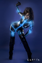 Young sexy latex woman on future costume, blue neon lights