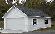 White shed with a double garage door