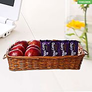 Apples in Basket along with Dairy Milk Chocolates