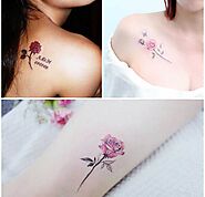 Tattoo with rose on shoulder