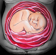 Realistic baby painted on the belly