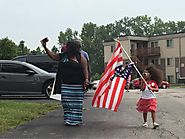 ᴅʀᴇᴡ ᴡᴇsᴛʜᴀᴜs on Twitter: "Young girl arrives, following her elders. American flag upside down. Waving with enthusias...