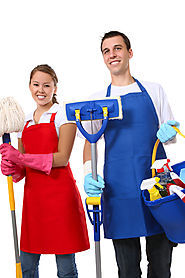Lady with red apron holding broom man with blue apron holding mop and cleaning supply bucket