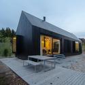 Format Elf Architekten's blackened timber cottages for a German resort