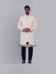 Off white jamawar groom sherwani design with golden buttons