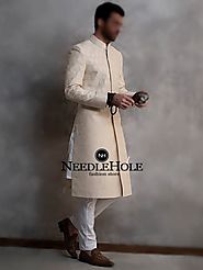 Raw silk cream wedding sherwani pajama for groom with embroidery all over the front and sleeves