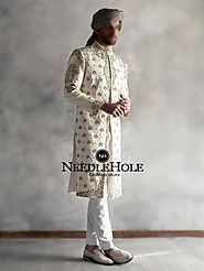Off white raw silk wedding sherwani suit for groom with embroidery on front, collar and sleeves