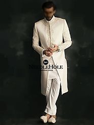 Be a best dressed groom on your big day in this heart stopping designer wedding sherwani attire in offwhite color