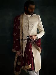 Be a handsome groom on your wedding day in this magnificent Pakistani wedding sherwani suit in off-white jamawar fabric