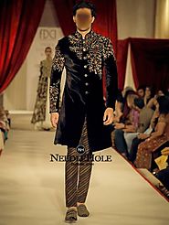 Hand embroidered sherwani in black color by Rohit Bal London