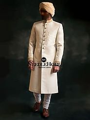 Go for classic elegance in the beautiful Pakistani wedding sherwani design in offwhite color suiting fabric