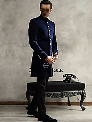 Tie the knot in this mesmerizing short length groom sherwani in navy blue suiting fabric
