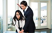 Dark haired secretary Megan Rain removes her glasses while banging her boss