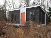 This Modern 227 Square Foot Charles Eames-style tiny house has it all!